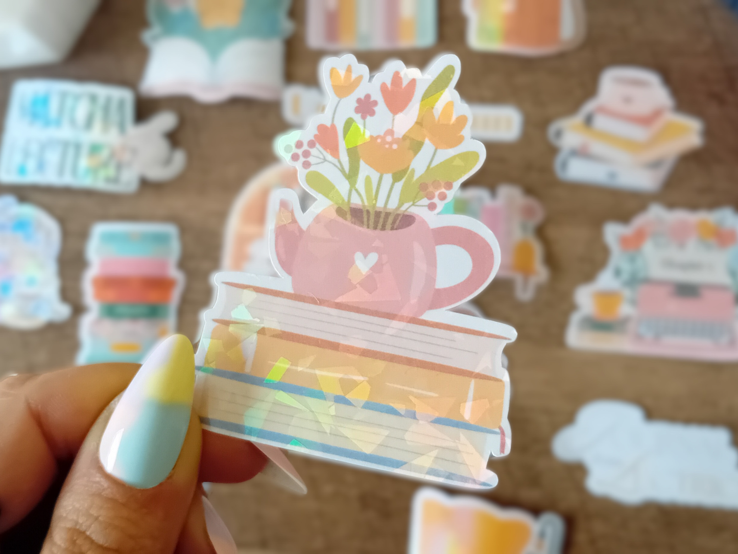 Waterproof Holographic Teapot Sticker on Stack of Books